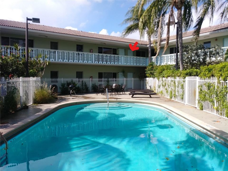 Pool area, red arrow is pointing to the unit's door