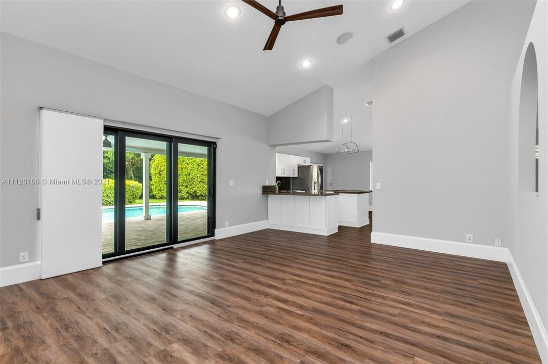 Living Area: Impact Glass, Open to Kitchen