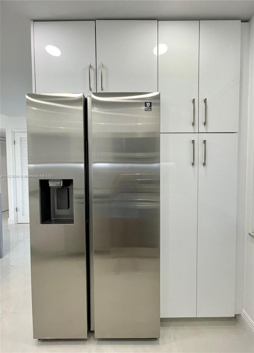kitchen featuring pantry and stainless steel fridge