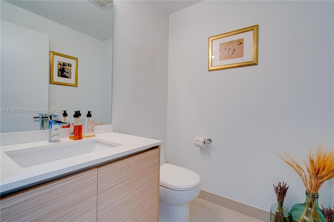 The half bath for your guests is conveniently located for your privacy.