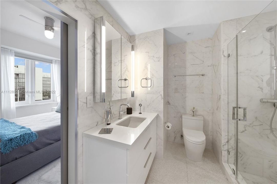 Main bath accessible by disappearing pocket door with hidden hardware.
