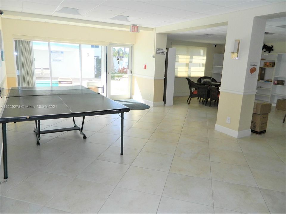 Clubroom with ping pong table leads to pool area