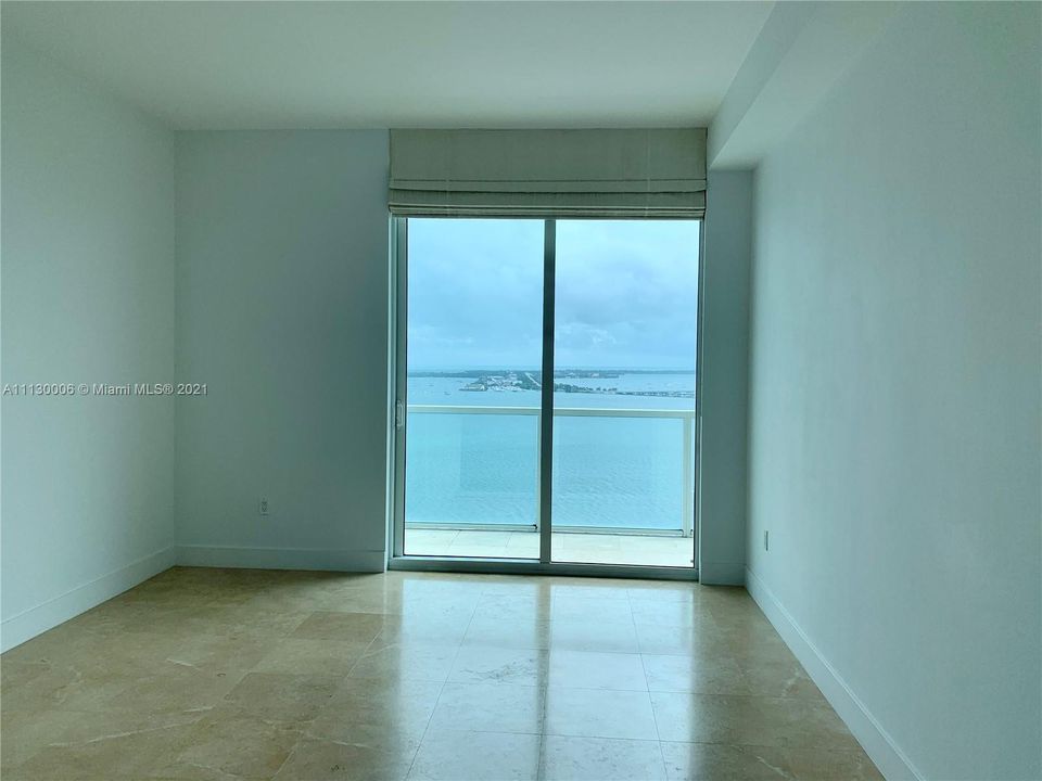 Master bedroom overlooking the bay with access to the balcony