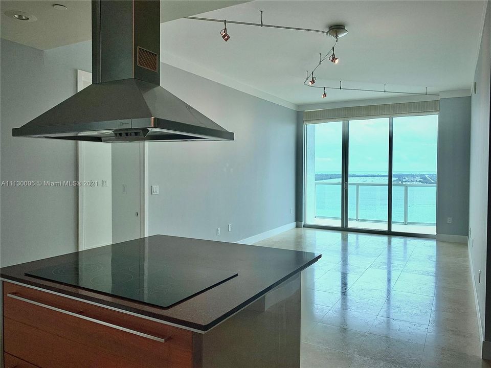 Kitchen toward living/dining area with beautiful views of Biscayne Bay.