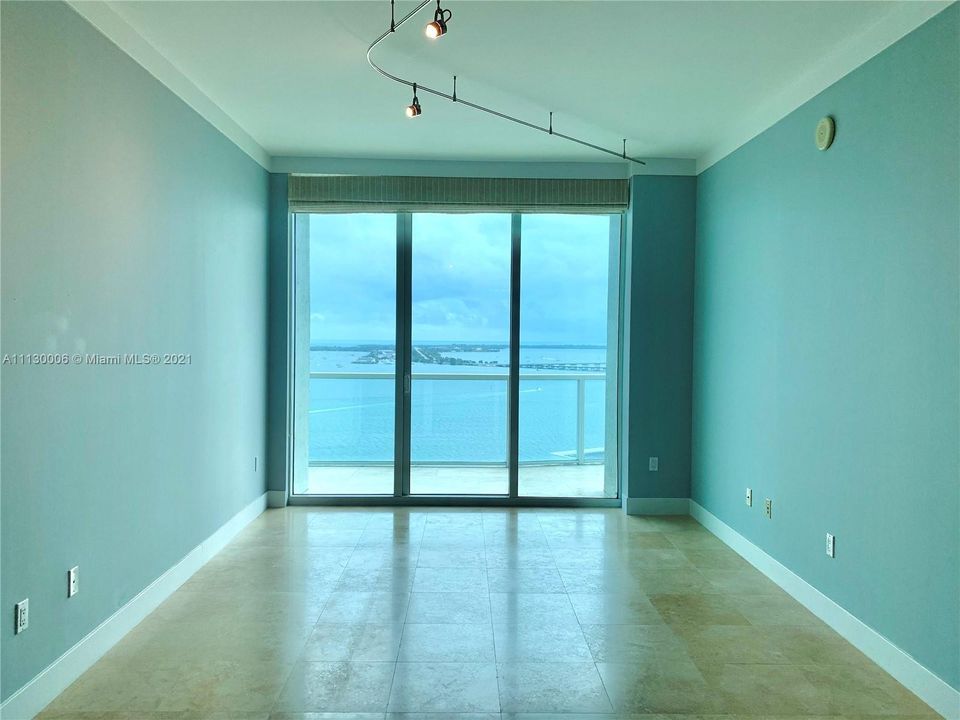 Living Room with gorgeous unobstructed views over Biscayne Bay.