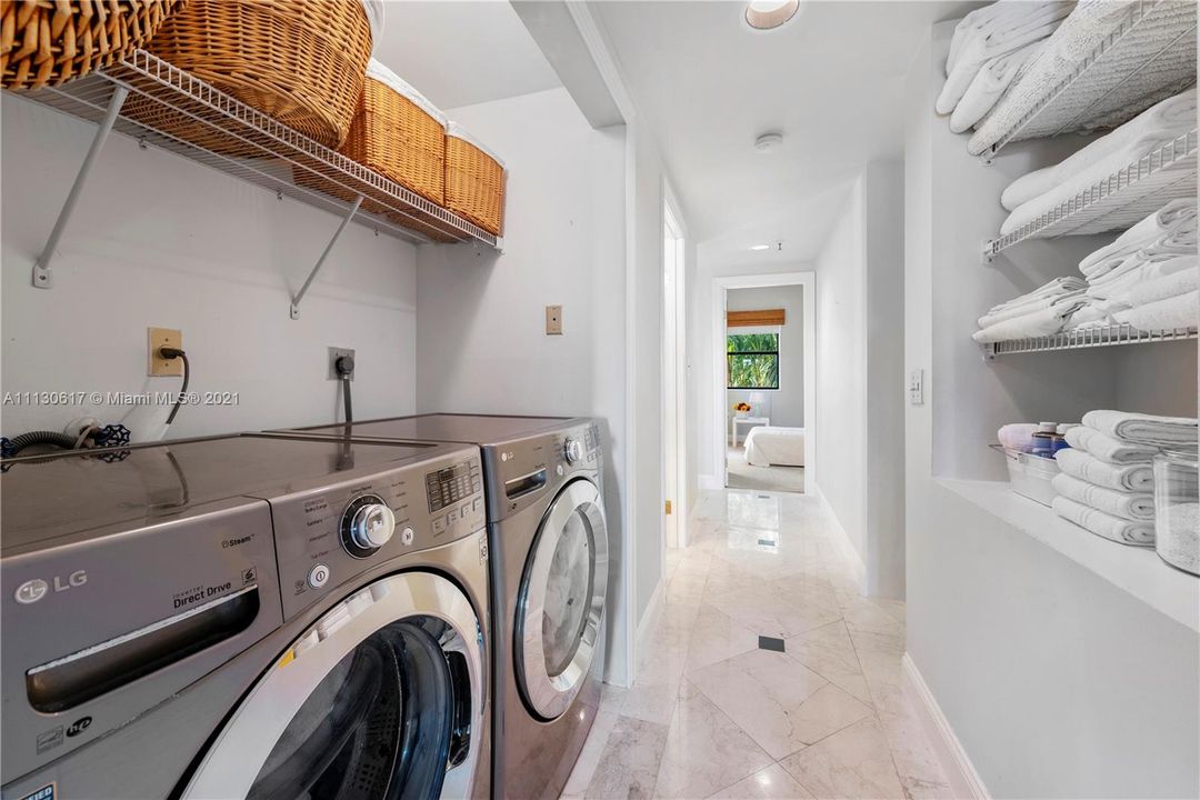 Full size washer/dryer with lots of shelving upstairs.