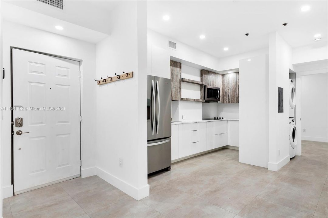 Enter the unit and find gorgeous tile flooring, open layout, renovated kitchen, and great lighting!