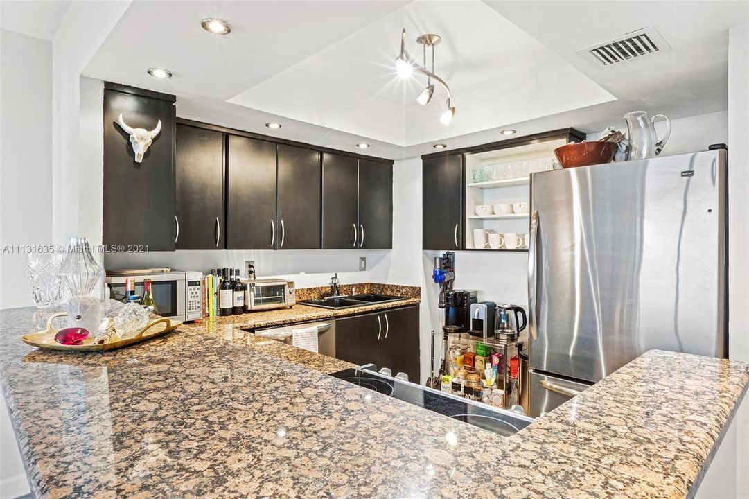 Marble countertops & stainless steel appliances.