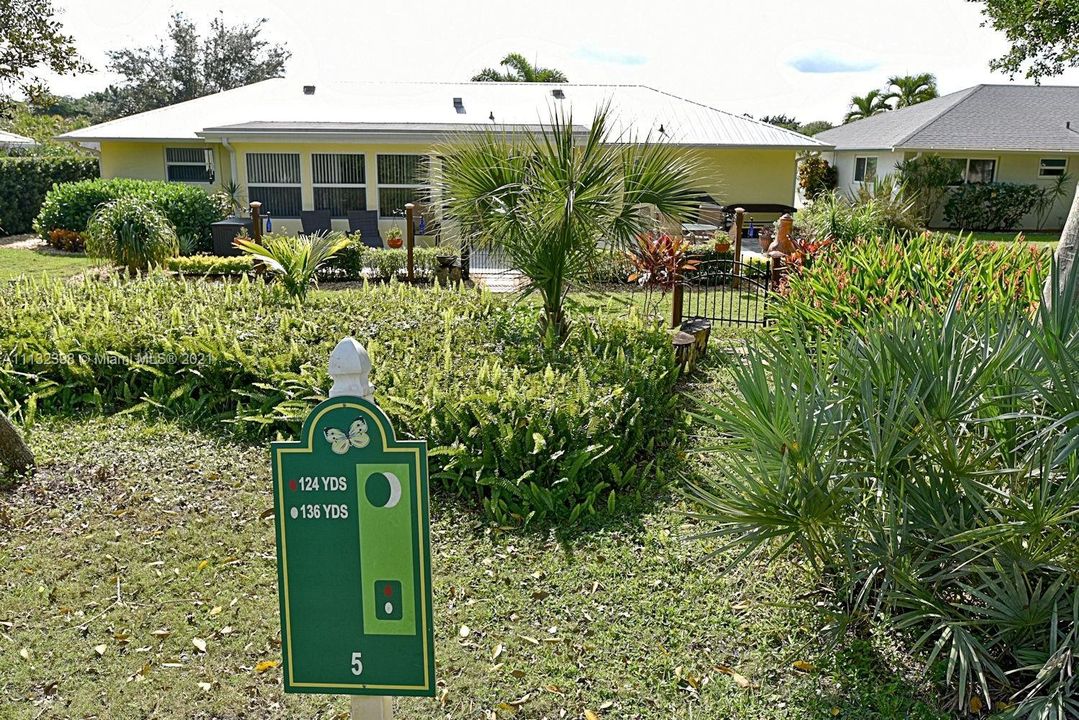 Backyard view of home and golf course