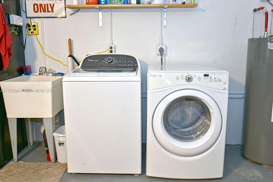 Laundry area plus extra  fridge