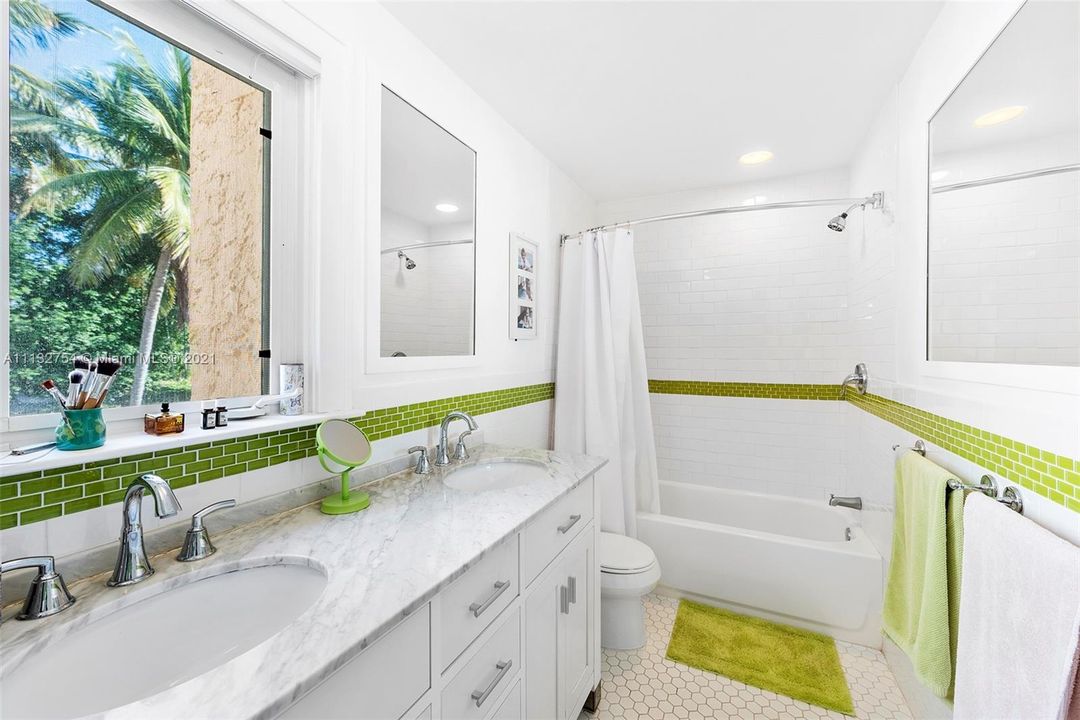Separate bathroom with double sinks & bathtub. Great for kids!