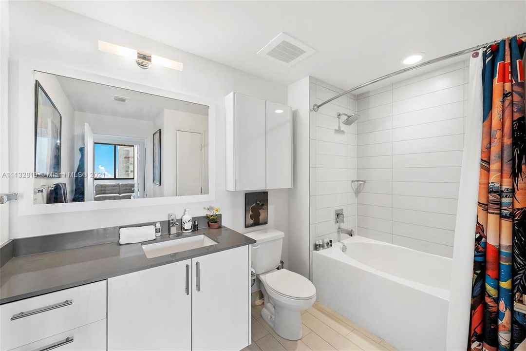 Separate bathroom. White and bright!