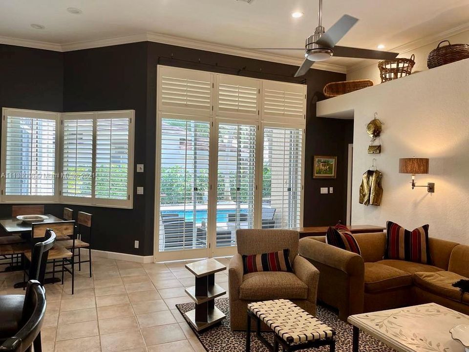 Spacious and beautiful family room with elegant plantation shutters.
