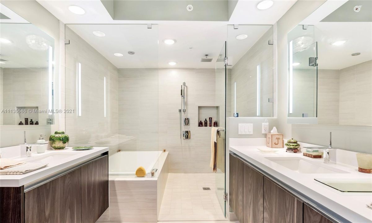 Primary Bath with Dual Back-Lit Vanities and Glass Enclosed Shower & Tub
