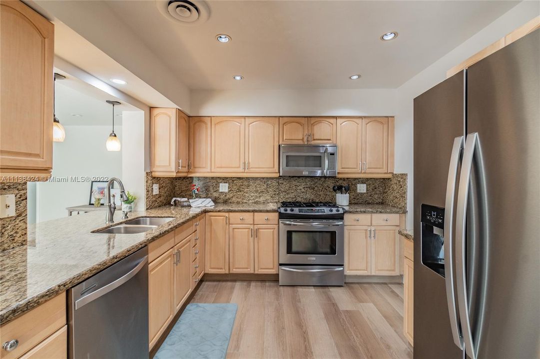 Kitchen with granite counters & stainless steel appliances