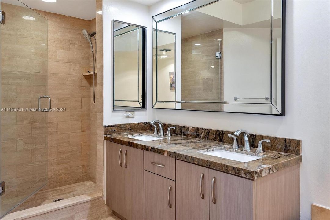 Partially renovated master bathroom with double sink