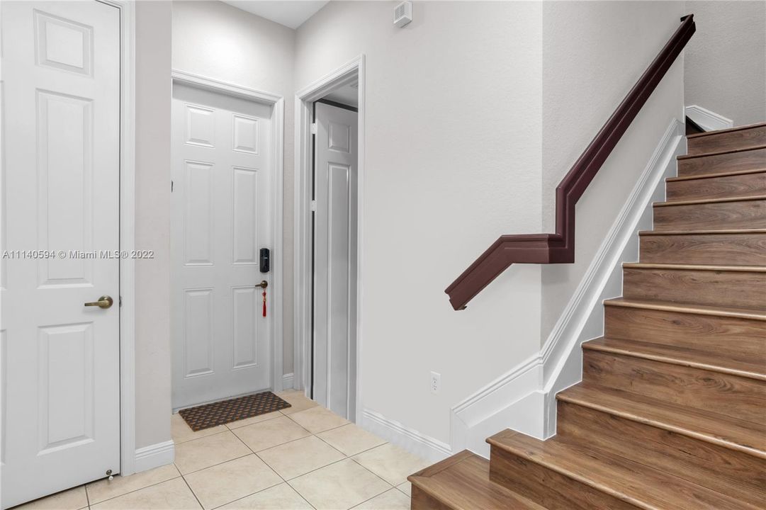 Spacious Foyer - Coat Closet, Half Bath,  Garage Door