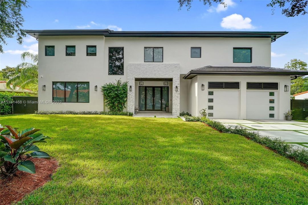 Front view with 2 car garage