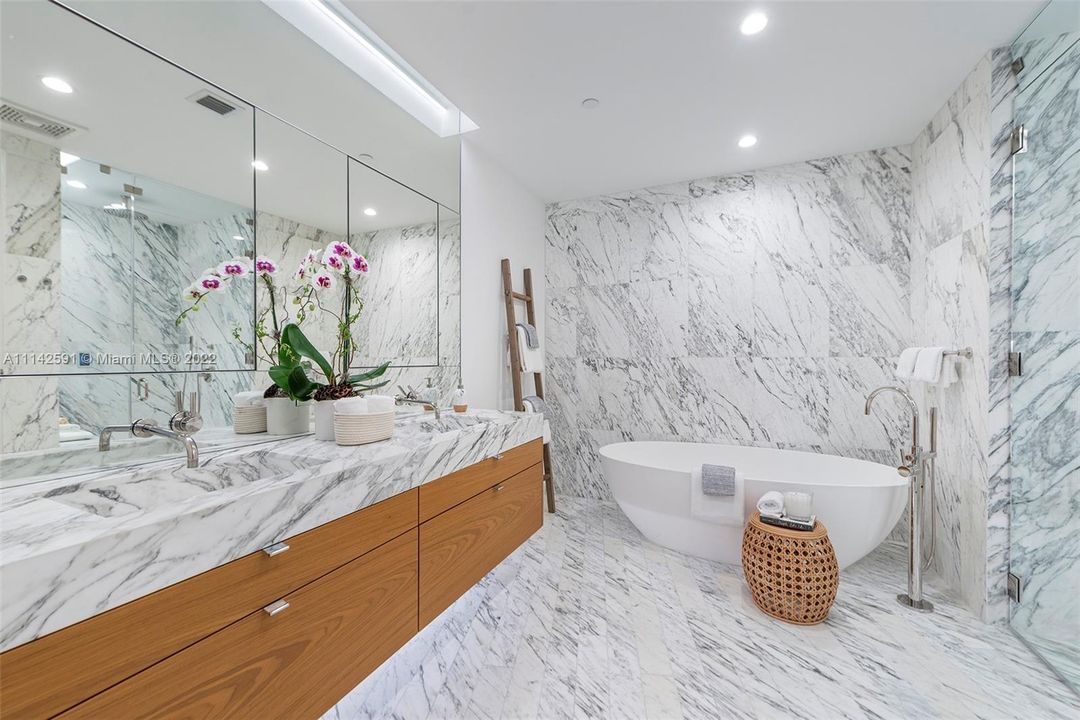Primary bathroom with custom design, marble countertops & dual sinks!