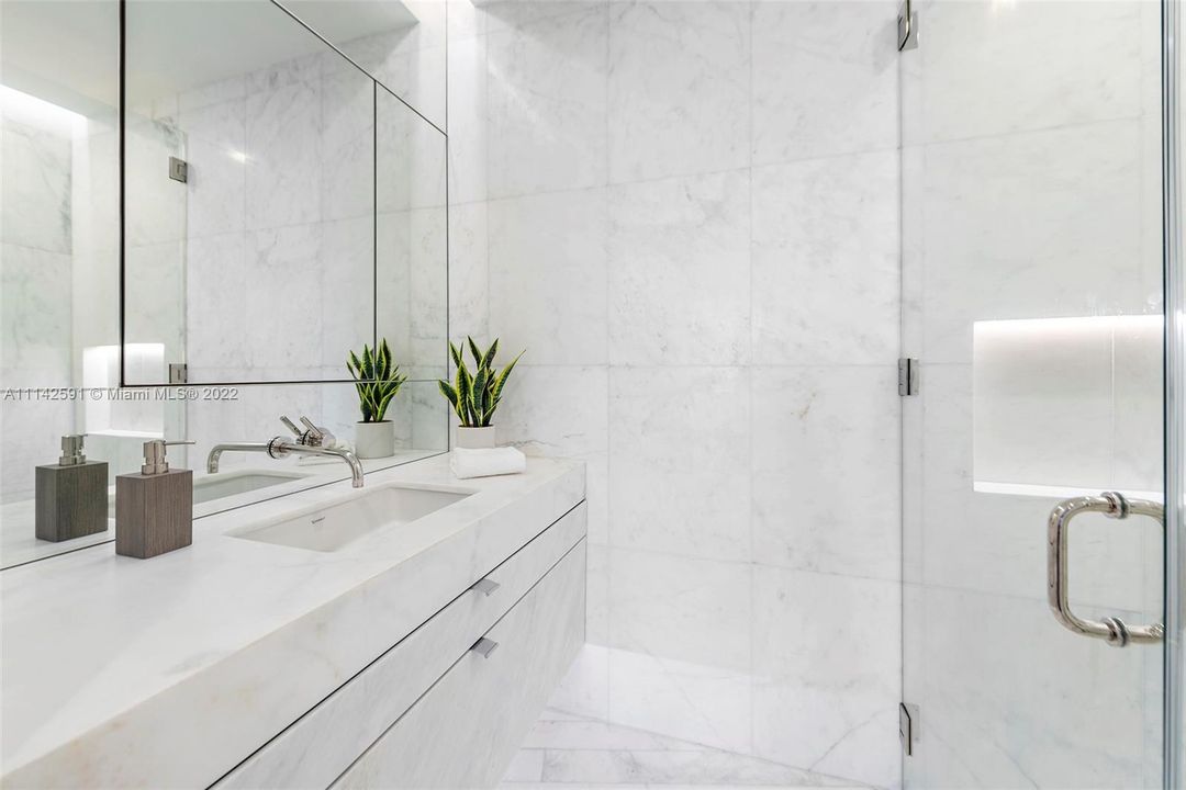 Gorgeous white ensuite bathroom in the second bedroom.