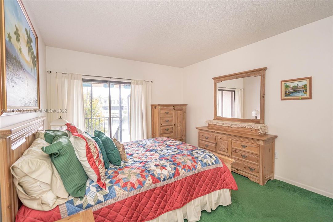 Down stair bedroom with sliding door to the patio.