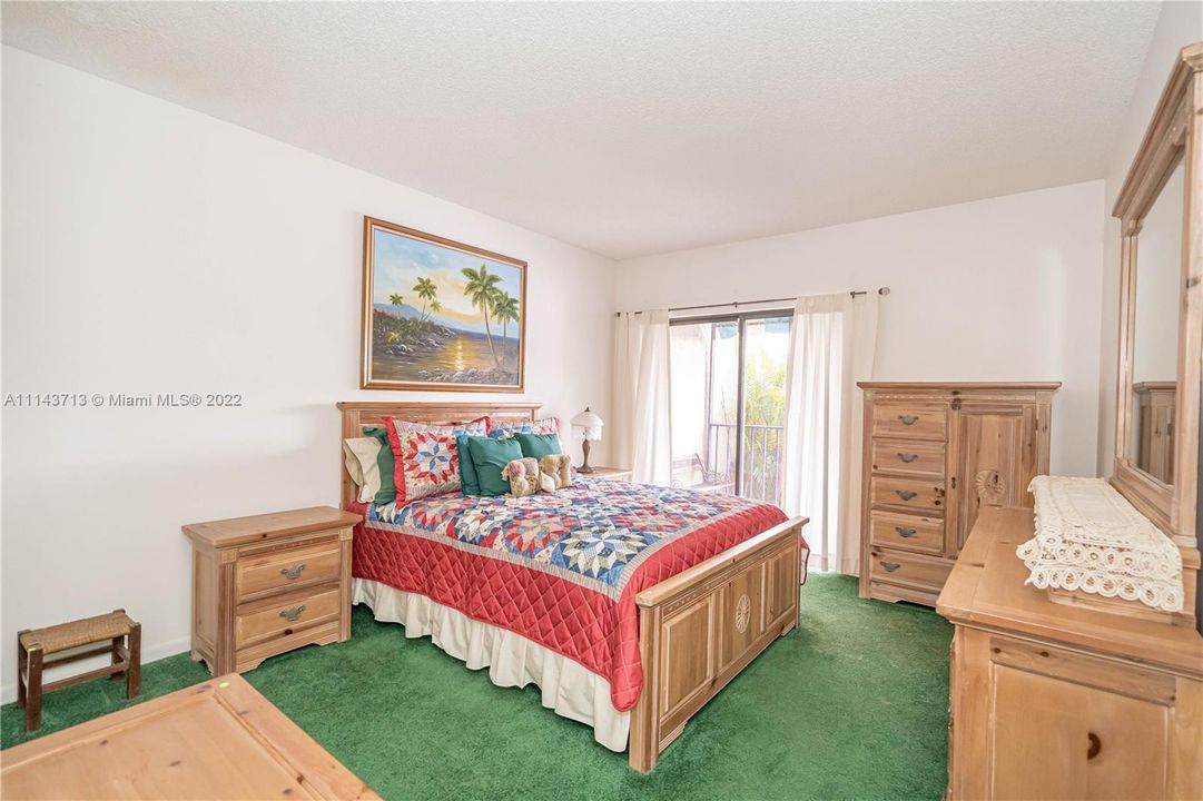 Down stair bedroom with sliding door to the patio.