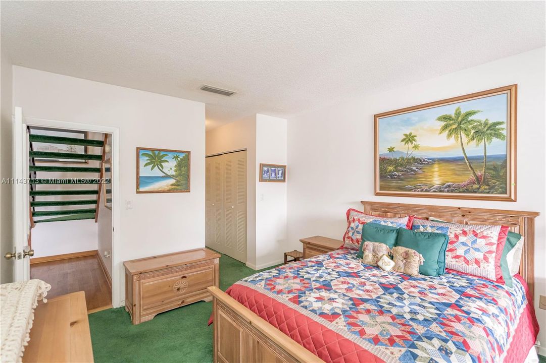 Down stair bedroom with sliding door to the patio.