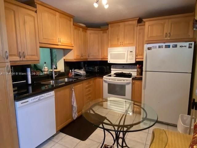 Kitchen with newer cabinets & granite counters