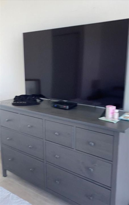 There is a new 8 drawer dresser and a 55inch TV in the bedroom