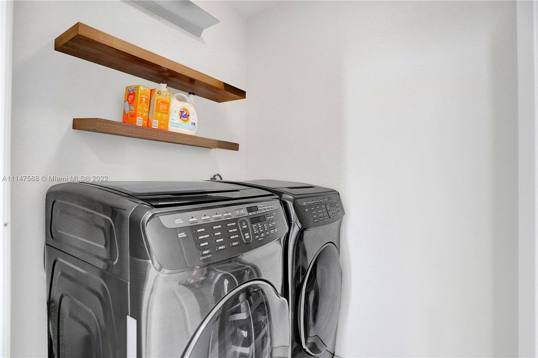 Separate laundry room is located between the kitchen and the entrance to the garage