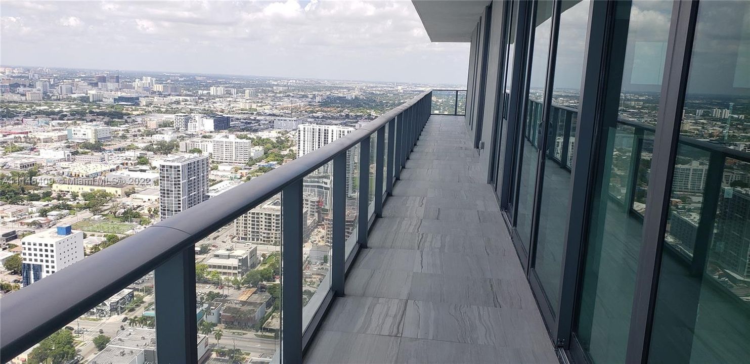 Oversized balconies facing the city and Biscayne