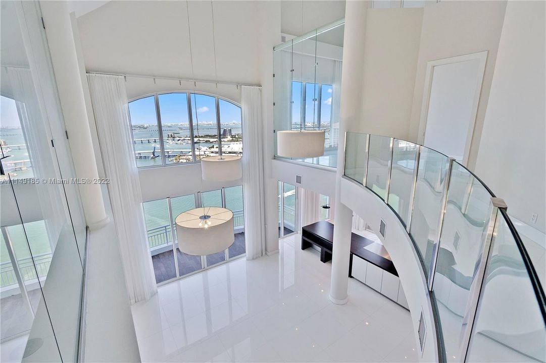 A second floor open hallway with stunning views that splits the two upstairs bedrooms.
