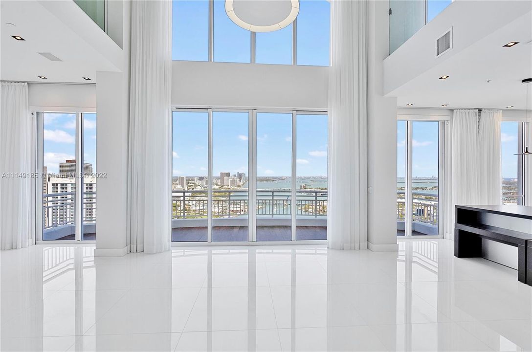 Enter into your 2 story top floor Penthouse with a giant living/dining area and stunning bay/ocean/city views.