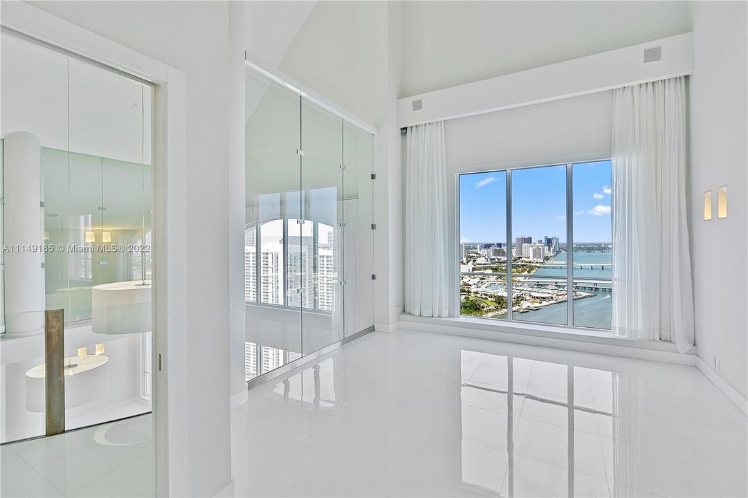 One of two large bedrooms on the second floor with stunning views and a built-in closet area.