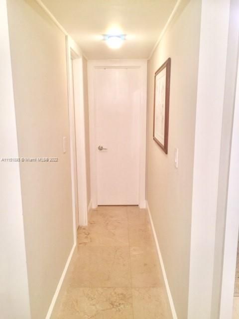 Entrance to closet and second bathroom in guest bedroom