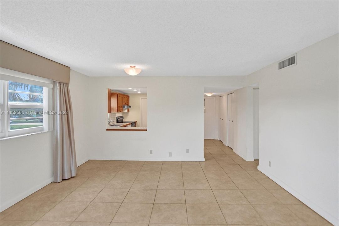 View to dining area and kitchen pass thru