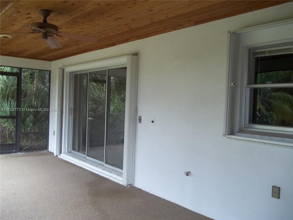 Covered screened patio, accordion shutters