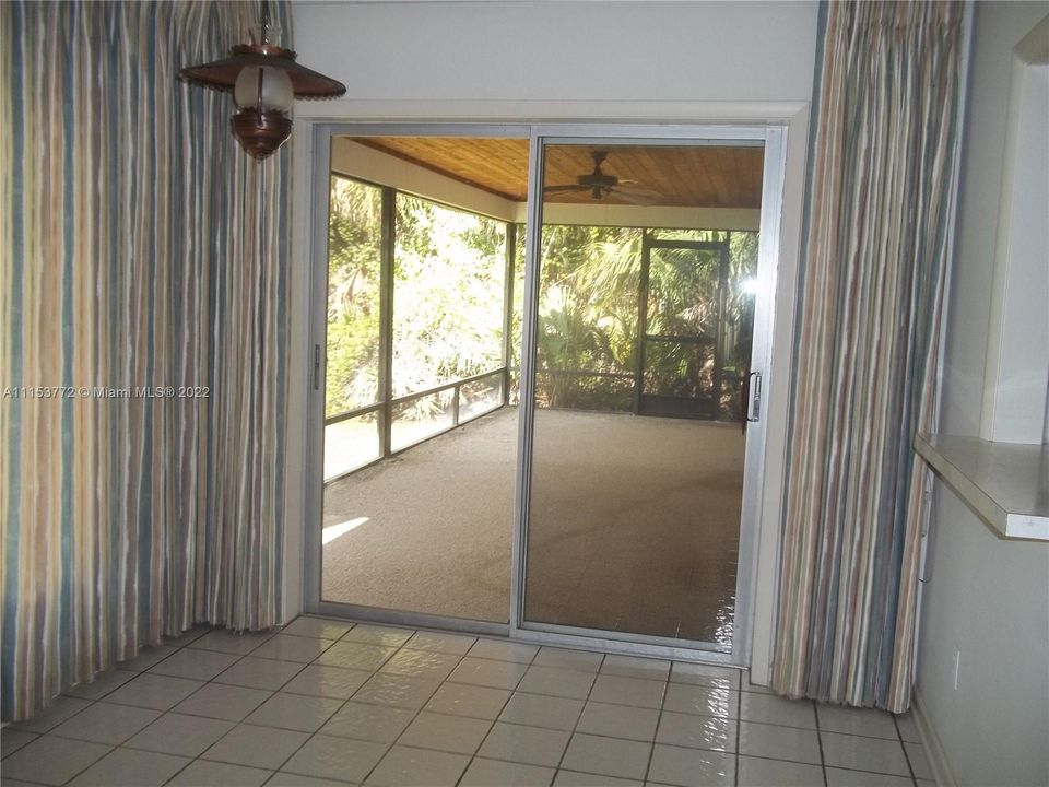 Slider off florida room opens onto covered patio