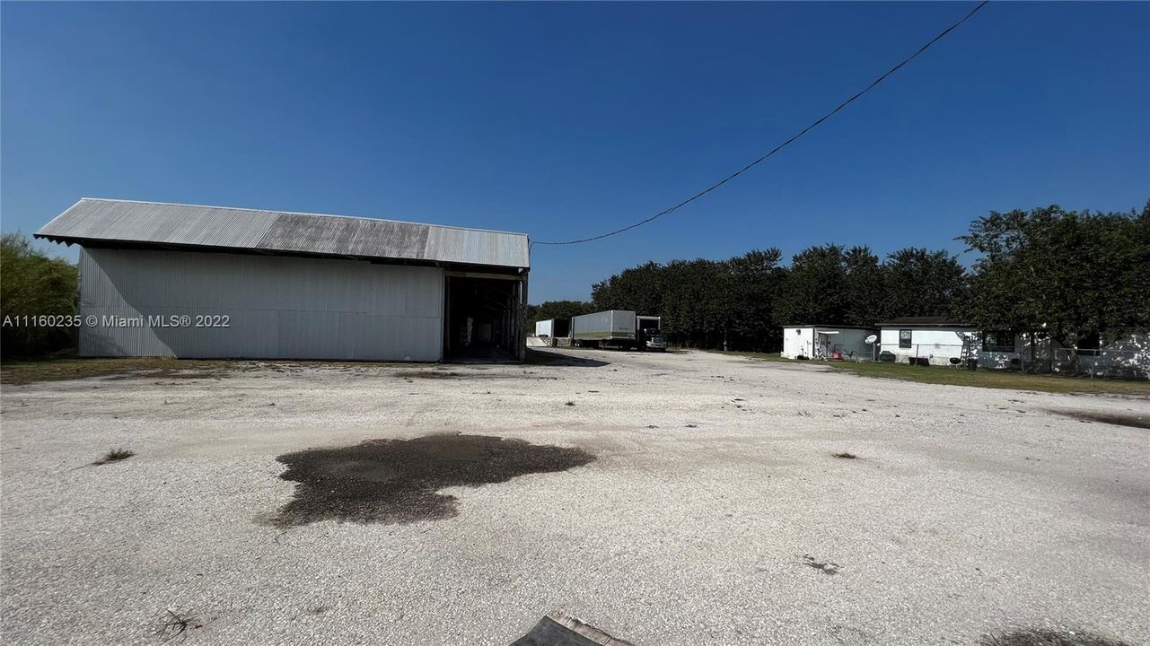 Entire view from the front of the property of the Pole building and the two Mobile Homes