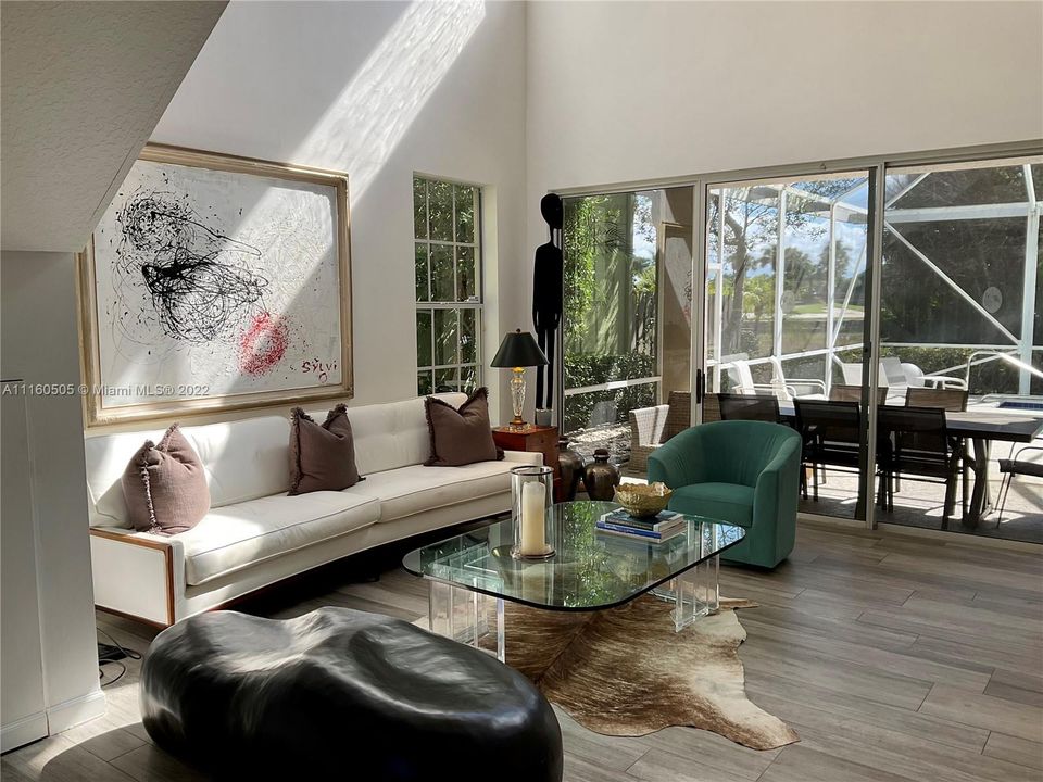 Living room with vaulted ceilings.