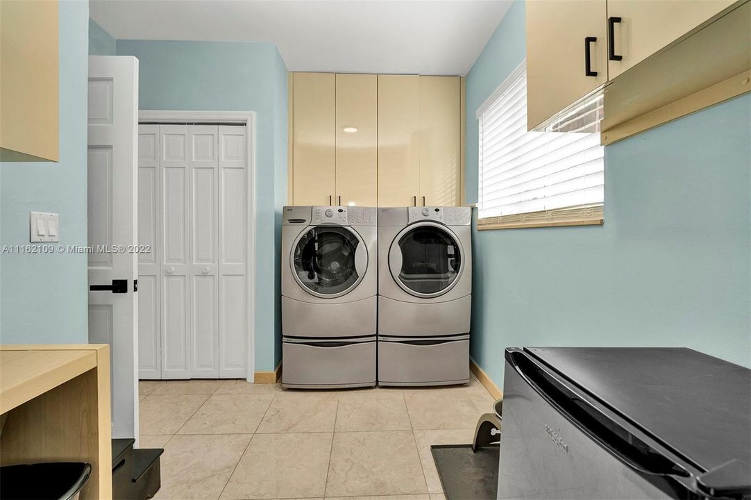 Laundry room with access to backyard