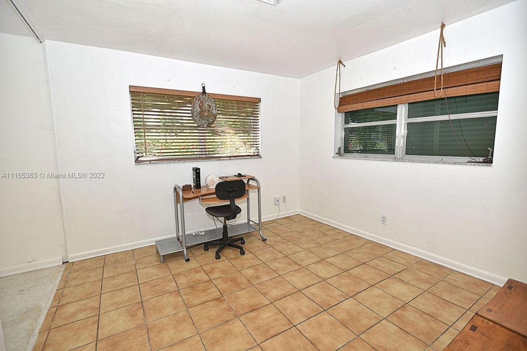 TILED SECOND BEDROOM HAS TWO WINDOWS