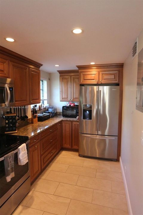 4. Kitchen with open floor concept and marble countertops