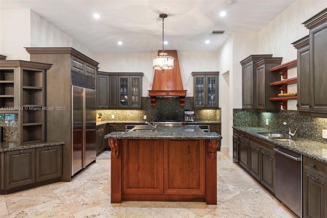 Gourmet gas kitchen which opens to family room and terrace. Terrific for the chef with tons of storage, two dishwashers, two sinks,kitchen desk with lots of book cases for your cookbooks, double ovens, lots of counter space on island.