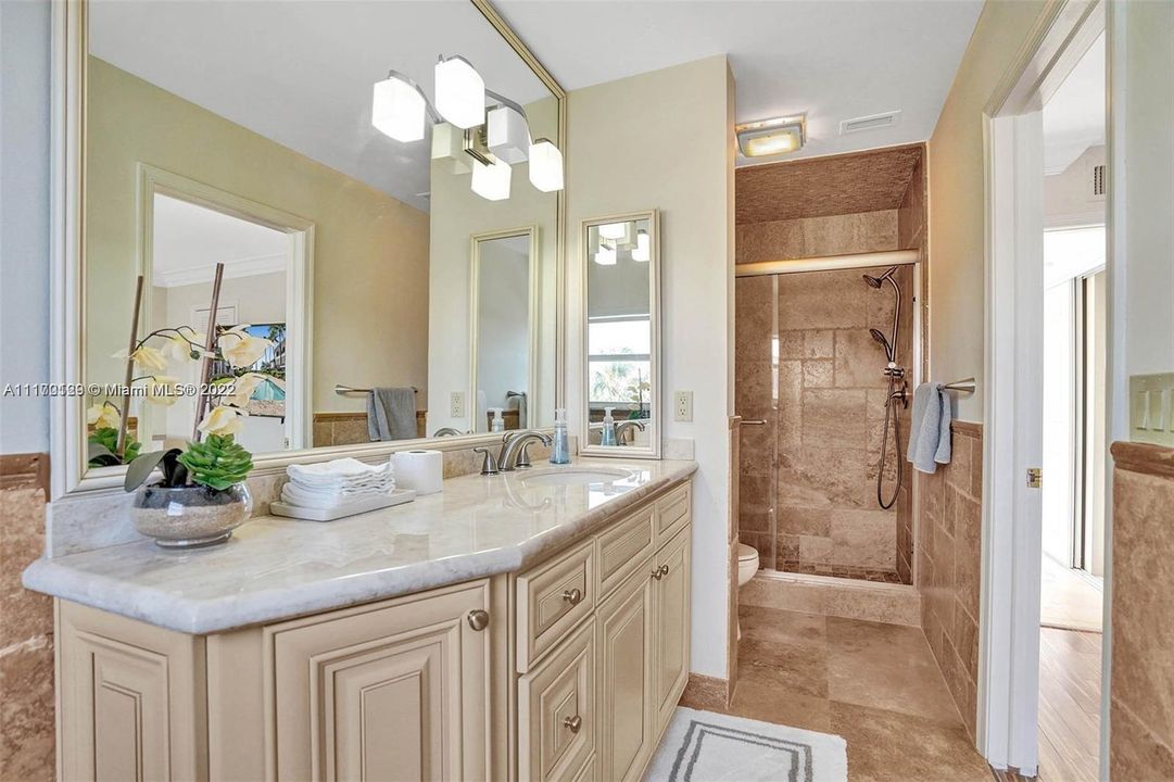 1 of 3 master-en-suites. tub and standing shower
