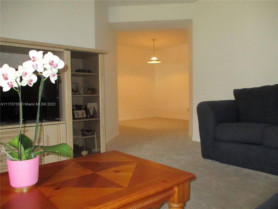 FROM LIVING AREA LOOKING INTO THE DINING ROOM