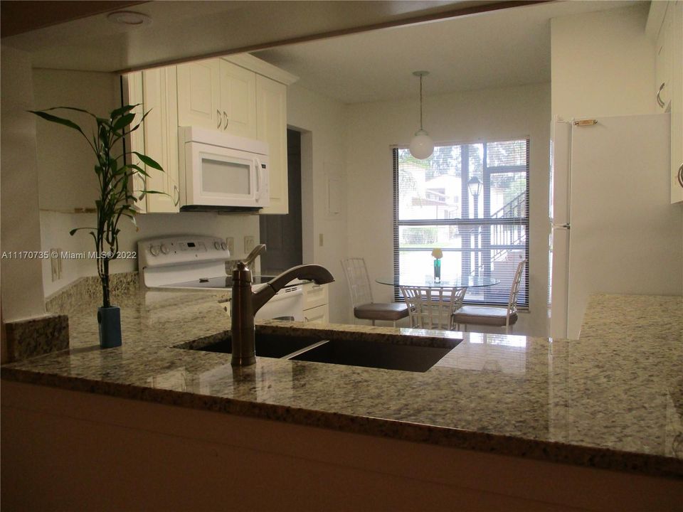 FROM DINING AREA YOU CAN VIEW OPEN KITCHEN AND BREAKFAST NOOK