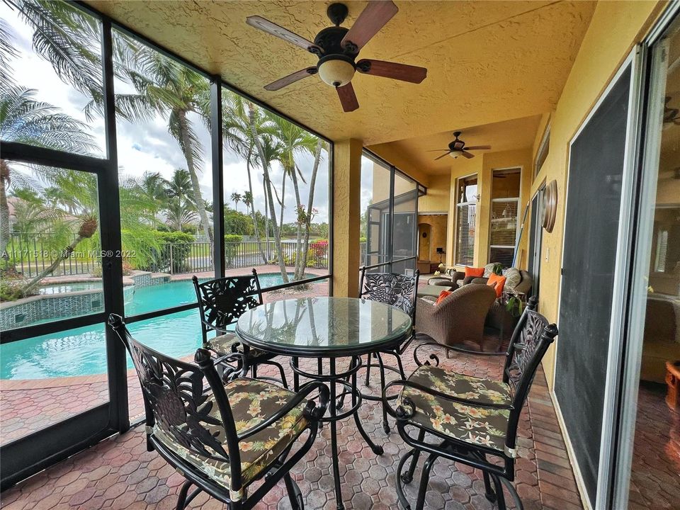 Patio - Screened sitting area with ceiling fans and lighting