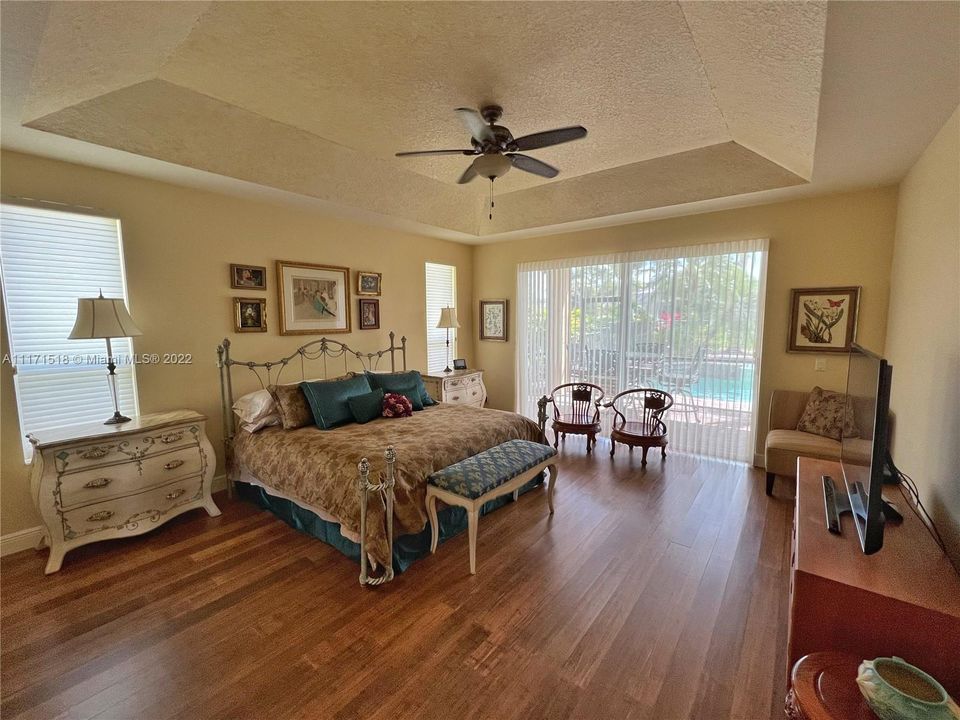 Master Bedroom - Vaulted Ceiling, Hardwood Bamboo flooring, sliding doors to patio