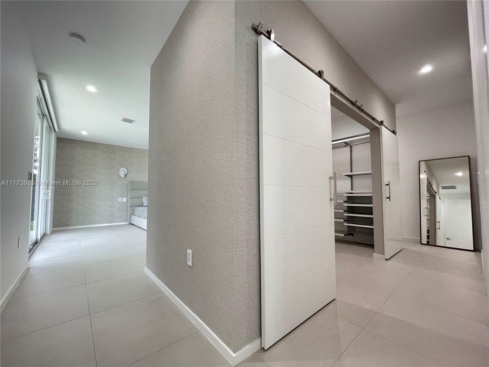 Entrance to master suite with large walk-in closet.